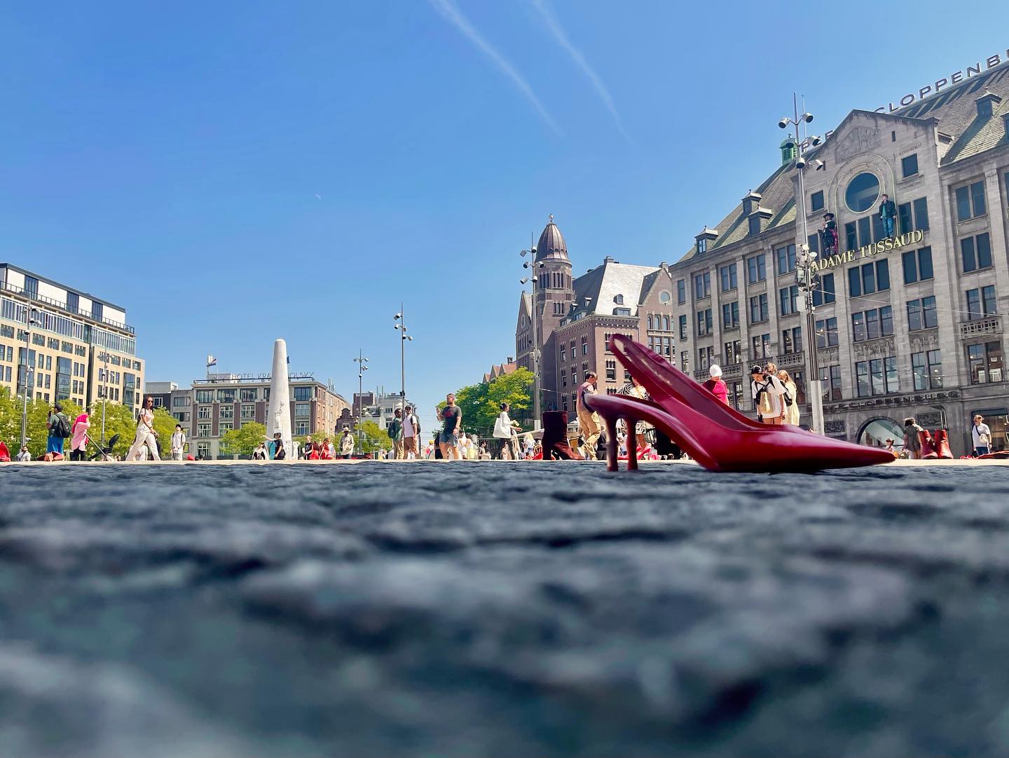 Red Shoes  #shoes #amsterdam #damsquare #netherlands #smlp #redshoes #shotoniphone #iphoneography #ontheground #red #street #summer #madametussauds #architecture